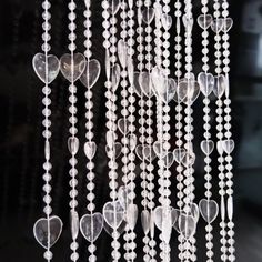 a group of heart shaped beads hanging from the ceiling