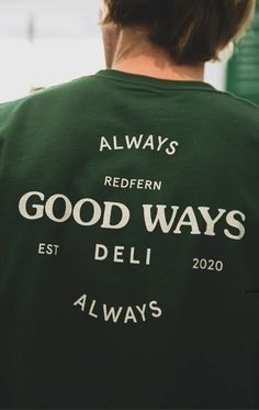 the back of a man wearing a green good ways t - shirt