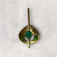 Vintage art deco inspired pendant with green accent Hold to slide the chain on In Excellent condition  Gold Filled  Measurement : 1 5/8" length Green Metal Collectible Jewelry, Retro Green Brooch Jewelry, Vintage Green Brass Jewelry, Mid-century Green Collectible Jewelry, Retro Brass Pendant Jewelry, Retro Metal Pendant Jewelry, Vintage Green Brooch Jewelry, Mid-century Green Formal Jewelry, Green Soldered Round Pendant Jewelry