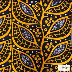 an african print fabric with yellow and blue designs on it's black background,