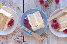 three plates with slices of cake and raspberries on them