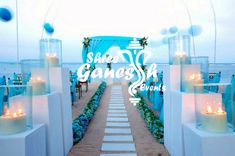 an outdoor wedding setup with blue and white decor