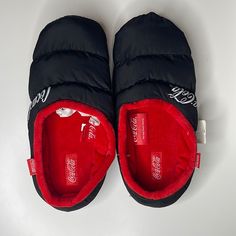 New Coca Cola Puffer Slippers Size S/M Perfect For Winter. Exclusive From The Coca Cola Store Black Casual Slip-on Slippers, Casual Black Slip-on Slippers, Black Casual Slippers With Cushioned Footbed, Comfortable Black Slippers For Leisure, Comfortable Black Slippers For Casual Wear, Casual Black Non-slip Slippers, Casual Non-slip Slippers For Streetwear, Casual Slippers With Cushioned Footbed, Casual Black Slippers For Leisure