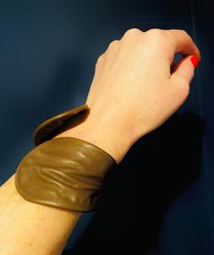 The perfect wrist accessory! 8"x 3" reclaimed leather cuff,wraps to be worn with fold in front or back. Fits to any wrist size!Current Colours: Hot Pink, Cherry Red, Cognac, Espresso, Wine, Onyx, Violet, Snake print Blk, Olive, Snake print Ecru, python print.Made to order Brown Cuff Leather Bracelet, Brown Cuff Bracelets As Fashion Accessory, Brown Cuff Bracelet As Fashion Accessory, Adjustable Brown Leather Bracelet For Party, Brown Leather Cuff Bracelet, Trendy Brown Cuff Bracelet, Brown Leather Cuff Bracelet With Wrist Strap, Adjustable Cuff Leather Bracelet, Adjustable Leather Cuff Bracelet For Party