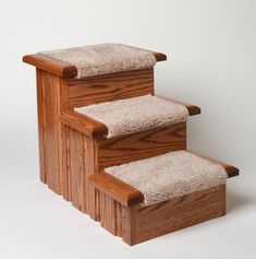 a set of wooden stairs with carpeted treads