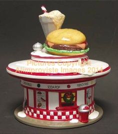 there is a statue of a burger and fries on top of each other