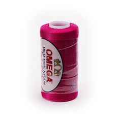 a spool of pink thread on a white background