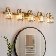 a bathroom with a mirror and lights on the wall