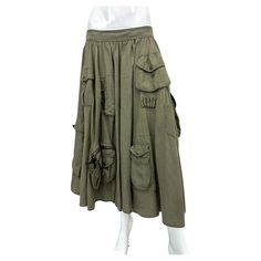 S/S 2003 Dolce & Gabbana midi skirt with big cargo pockets. Military inspired design. Composition: linen, made in Italy Conditions: great, no significant flaws Size: missing size tag Waist: 40cm / 15,7inches Total length: 75cm / 29,5inches Summer Khaki Cargo Skirt With Side Pockets, Green Cotton Cargo Skirt With Side Pockets, Utility Skirt With Pockets In Khaki, Summer Cotton Skirt With Multiple Pockets, Khaki Knee-length Skirt With Pockets, Green Utility Cargo Skirt With Pockets, Khaki Cotton Cargo Skirt With Multiple Pockets, Green Tiered Skirt With Pockets, Bohemian Knee-length Bottoms With Pockets