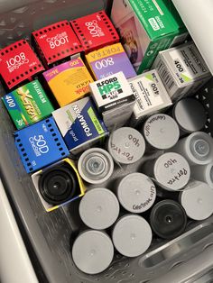 an open container filled with lots of different colored boxes