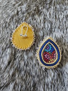 These gorgeous blue and gold beaded earrings are the perfect accessory for your next ceremony, powwow, or for every day wear! Made with size 11 Miyuki beads and backed in deer hide. Centers are kokum scarf fabric and expoxy. Due to the nature of this product, I cannot accept refunds or exchanges. Please message me directly if you have any questions. Artisan Multicolor Beaded Earrings With Gold Beads, Artisan Beaded Earrings For Festive Occasions, Artisan Gold Beads Earrings For Festival, Gold Beads Teardrop Earrings For Party, Gold Beaded Drop Earrings For Festivals, Bohemian Earrings With Bead Caps For Party, Festive Beaded Teardrop Earrings, Gold Beaded Festival Earrings, Gold Teardrop Beaded Earrings With Tiny Beads