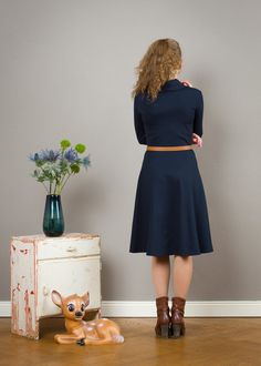 "Simple elegance! A beautiful dark blue dress is made of thicker knit fabric with a wide skirt and 7/8 sleeves. Especially nice is the shawl collar. The bodice is form-fitting and the skirt swings at each movement of the loose-fitting form. (without the belt) Size / Weight / Length: variable from 90-110 cm (100 cm in the photo) \"Elli\" is available in german sizes 36-42. It's also possible to sent us your measurements! materials Viscose, Spandex Care instructions: Wash at 30 degrees, iron hot f Fitted Dress With 3/4 Sleeves For Winter, Winter Fitted Dress With Flared Skirt, Fitted Flared Dress For Fall, Elegant Winter Dress With Flared Skirt, Navy Fitted Winter Dress, Navy Midi Dress For Fall, Round Skirt, Wide Skirt, Dark Blue Dress