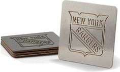 two new york rangers coasters sitting next to each other