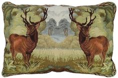 two deers are standing in the woods on this decorative pillow