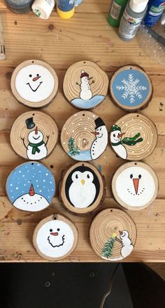 wooden plates with snowmen painted on them