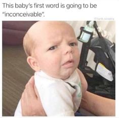 a man holding a baby in his arms and the caption reads, this baby's first word is going to be inconceevable