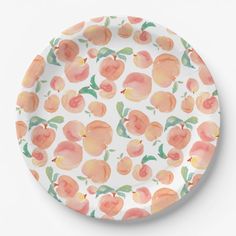 an orange and white plate with peaches on it