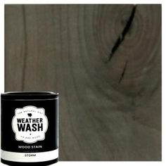 a can of weather wash wood stain sitting on top of a wooden floor next to a white wall