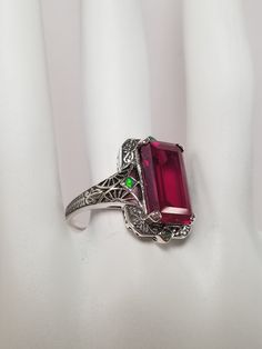 "Thanks for shopping our vintage estate store. We tend to sell well below wholesale and truly hope you enjoy all of our items. Many of the items are one of a kind, so please enjoy scrolling through the pictures and hopefully something will catch your eye. Brown spots are from the camera or reflections. Estate sterling silver 925 red ruby opal ring. Custom made item from our shop, meaning we added the gem to the setting. Retails $189 on sale $69 (can be sized for $10) Ring size: please select a s Red Art Deco Ruby Ring For Formal Occasions, Art Deco Red Ruby Ring For Formal Occasions, Formal Art Deco Red Ruby Ring, Red Vintage Filigree Ring With Gemstone, Vintage Red Hallmarked Filigree Ring, Vintage Red Emerald Cut Rings, Vintage Red Filigree Ring, Vintage Red Jewelry Stamped 925, Art Deco Hallmarked Ruby Ring For Gift