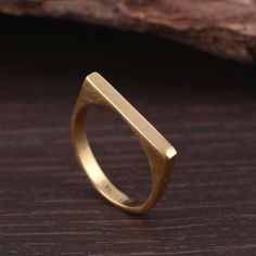 Signet narrow flat square gold ring, rectangle signet ring for women, flat surface gold ring, thin solid brass band, flat top, plain Stone:- Material:- Brass Size:- Any Please Visit Our Shop to View Complete Collection. If You Need Faster Shipping, Please Contact us ♥Please Make Sure to Include The Correct Address During Before Order. You Can return the Item within 30 Days After Successful Delivery. We Offer a 100% Money Back Guarantee If You Not Satisfied With Your Purchase. Return Charge Will Gold Bar Ring, Lingot D'or, Signet Rings Women, Signet Ring Men, Bold Rings, Bar Ring, Square Ring, Midi Ring, Geometric Ring