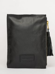 This bag is made from high-quality, super-soft black leather sourced from a premiere hide house in California. The leather is shipped to New York City, where our bags are produced by expert craftsmen and finished with a smooth zipper, leather tassel, and acrylic ring. Just big enough for all your essentials, we designed the Ring Wristlet to be your go-to bag for going out! Whether you’re heading to a cocktail party, a concert, or out on the town, slip it on your wrist so your hands are free for House In California, Book Table, Acrylic Ring, Shoe Gifts, Big Bags, California Homes, Leather Tassel, Bag Dress, Jewelry Bags