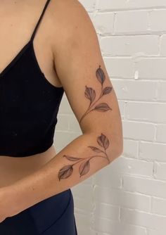 a woman with a tattoo on her arm