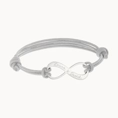 Our versatile Men's Personalized Infinity Bracelet with sliding knot fastening can be personalized with a hand-engraved message and choice braid color.925 Sterling SilverInfinity charm: 1” x 0.4”Braid made of durable, colorfast polyesterSize: between 8-9, fully adjustable sliding knot fasteningEngraved by hand in our Paris workshopSent with love in a complimentary gift boxAny slight variations in lettering depth, spacing and alignment from the examples shown are part of the aesthetic and origina Personalized Silver Braided Bracelets For Friendship, Adjustable Engraved Braided Friendship Bracelets, Father's Day Adjustable Engraved Braided Bracelets, Adjustable Engraved Braided Bracelet For Friendship, Father's Day Engraved Adjustable Braided Bracelets, Father's Day Engraved Adjustable Braided Bracelet, Personalized Silver Braided Bracelet Minimalist Style, Personalized Silver Braided Minimalist Bracelet, Adjustable Infinity Bracelet For Personalized Gift