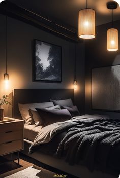 a bed sitting under two lamps in a bedroom