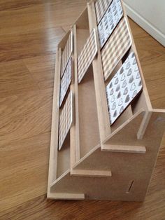 an open cardboard box sitting on top of a hard wood floor