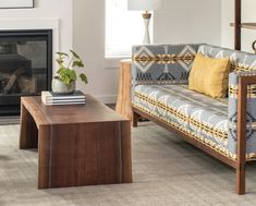 a living room filled with furniture and a fire place