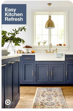 an image of a kitchen with blue cabinets