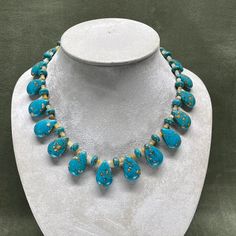 An elegant necklace of turquoise and yellow jade will get compliments whether you are at work or out for an evening event. It will glow on a dark top and be a colorful accent above an open neckline. It also has matching earrings. At 19.5 inches (49.5cm) it will display lower than a choker for a comfortable fit. Turquoise Jade Necklace With Gemstone Beads, Adjustable Turquoise Jade Beaded Necklace, Elegant Turquoise Jade Necklace, Hand-strung Turquoise Jade Beaded Necklaces, Yellow Jade, Handmade Turquoise Agate Beads, Gems, And Cabochons, Elegant Necklace, Elegant Necklaces, Wedding Jewellery Necklace