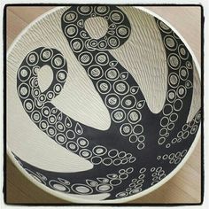 a black and white bowl with an octopus on it