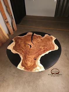 a table made out of wood and black plate