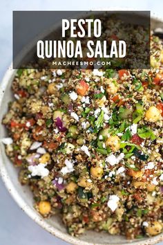 a white bowl filled with quinoa salad on top of a table