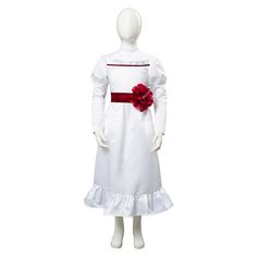 a woman's white dress with red flowers on the waist and sleeves, in front of a mannequin head