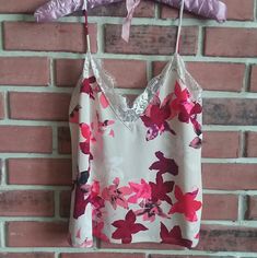 Polyester Cream Color With Various Pink Shades And Wine Colored Flowers Laced V-Neck Feminine Pink Floral Print Camisole, Trendy Pink V-neck Camisole, Pink Floral Print V-neck Camisole, Pink Shades, Colored Flowers, Summer 24, Floral Tank Top, Floral Tank, Wine Colored