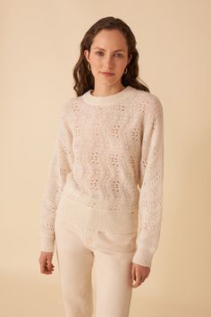 This chic jumper boasts a boho vibe, featuring a simple shape and openwork details on the knit. Warm and cosy against bare skin, it's a winter must-have.• Merino wool jumper• Slightly high round neck• Fancy openwork knit• Long sleeves with seamless armholes• Gathered ribbing on the cuffs and bottom• Chic jumper in Italian yarn from the "Fantaisie" group, composed of baby alpaca, RWS-certified merino wool and recycled polyamide. This combination of three fibres makes the material soft, thermal, h Winter White Crew Neck Pointelle Knit Sweater, Winter White Pointelle Knit Sweater For Fall, Chic Cream Pointelle Knit Sweater, Cream Pointelle Knit Sweater For Fall, Chic Cream Open Knit Sweater, Bohemian Pointelle Knit Top For Fall, Cream Pointelle Knit Top For Fall, Fall Cream Pointelle Knit Top, Cream Open Knit Top For Fall