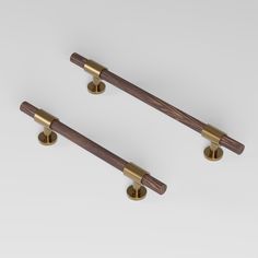 REFINED Pull bar 150 mm in brushed brass and wenge by BRANDT Collective luxury cabinet hardware Pull Bar, Cabinet Fronts, Subtle Beauty, Hardware Shop, Wardrobe Cabinets, Brass Pulls, Hardware Finishes, Store Interior, Shop Interiors