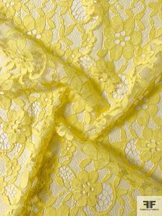 yellow lace fabric with flowers on it