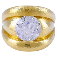 An impressive chunky 18k gold band ring featuring an Old European cut diamond. A striking combo of the big (4.86 carats) diamond mounted flush in the gold creates a great look. The gold is slightly textured which adds to the massiveness of the ring. Rounded sculptural edges perfectly frame the diamond. Whether it's a big party or an important meeting, this diamond ring will make a powerful statement wherever you go. This cocktail ring is made of 18 karat yellow gold (stamped) and set with a 4.86 The Big 4, Antique Jewelry Rings, Sculptural Jewelry, Art Deco Movement, Big Party, Gold Band Ring, European Cut Diamonds, Art Deco Jewelry, Gold Band