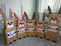 several cardboard boxes with reindeer faces on them and the words'grace, alice, jesus'painted on them