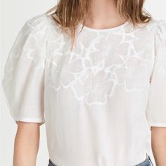 Nwt! Originally 398! Tonal Floral Embroidery Accentuates The Yoke And Sleeves Of This Veronica Beard Top, Which Is Crafted From Feather-Light Voile And Designed With A Subtle High-Low Hem. Add High-Rise Jeans To The Mix To Accentuate Your Look. Great For Going Out Or Casual. Fabric: Lightweight, Non-Stretch Weave Embroidery Details Curved Split Hem Crew Neck And Elbow-Length Sleeves Button Closure Keyhole At Back Shell: 100% Ramie Dry Clean Imported, India Style #Vbear31960 Summer White Blouse With Tonal Embroidery, White Blouse With Tonal Embroidery For Spring, Spring White Blouse With Tonal Embroidery, White Short Sleeve Tops With Tonal Embroidery, Feminine White Embroidered Top, White Tops With Tonal Embroidery, White Feminine Embroidered Short Sleeve Top, India Style, Feather Light