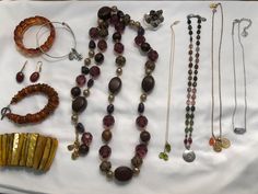 19 piece collection of  high-quality boho jewelry from the 70s to early 2000s. All in excellent to new condition. Many pieces * were purchased for over $100 each. The lot includes :  70s amber stretch bracelet Early 2000s Alex & Ani silver bracelet with fleur de lis & recycle or karma (what goes around comes around) charms 70s amber drop earrings on 14K wires 80s amber bracelet with stamped silver T-bar closure 70s stretch shell bracelet, gorgeous yellow gold with iridescence * Early 2000s Long Early 2000s Accessories, Early 2000s Jewelry, Jewelry 70s, 2000s Accessories, 2000s Jewelry, 2000s Boho, Lavender Stone, 70s Jewelry, Shoulder Duster Earrings