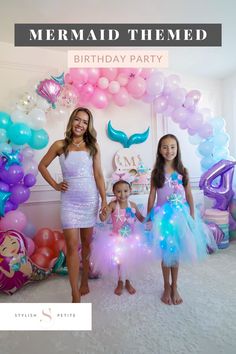 A image of a mom and two daughters dressed in mermaid themed dresses standing in front of a mermaid themed birthday party Under The Sea Birthday Party Outfit, Mermaid Birthday Party Outfit, Under The Sea Dress, Sea Themed Birthday Party, Mermaid Themed Birthday Party, Mermaid Theme Birthday Party, Themed Birthday Party Ideas