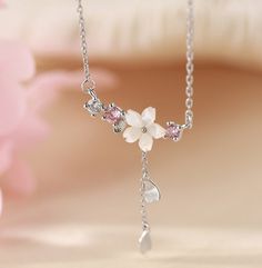 ♡ Clear White Cherry Blossom Spring Flower. Make Hearts Drop With This Silver Plated Spring Flower Necklace ♡ ♡ At Froppin, we believe everyone must have their flower! Like they do zodiacs and birthstones! Beautiful and delicate, this Cherry Blossom flower necklace makes the perfect gift to delight yourself or those you love! The large spring flower at center evokes strong feelings of serenity and internal clarity, especially when kissed by the light. A gorgeous, versatile piece that shines thro Elegant Heart Jewelry For Spring, Elegant Heart-shaped Jewelry For Spring, Elegant Heart Shaped Jewelry For Spring, Flower Shaped Necklace For Valentine's Day, Pink Flower Necklace With Clavicle Chain, Cute Flower Necklace With Flower Charm, Pink Flower Clavicle Chain Necklace, Cute Flower Jewelry For Valentine's Day, White Flower Necklace For Mother's Day