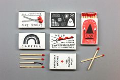 matchboxes with matches and matchesticks are arranged on a gray table top