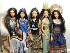 several dolls are standing next to each other