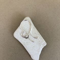 "I made these fancy teardrop earring hooks using 20 gauge .925 sterling silver wire.  I hand formed the ear wires and then gradually hammered the ends and bottom of the teardrop loops to make them more interesting. They are then hand sanded to a smooth finish and tumbled for extra strength and shine. Approximate Measurements: Length: 1\" (26mm) Width: just a little over 1/2\" (14mm) Teardrop Width: 1/4\"  (7mm) These are sold by the pair. If you need more than 20 pairs, please contact me so that arrangement can be made. Please note, I make these earring hooks by hand, there may be some slight variations from pair to pair.  Please Read: All items in my shop are made to order. Make sure you check out my shop announcement for current production times.  Thank you!  If you would like to see mor Sterling Silver Minimalist Drop Wrap Earrings, Minimalist Sterling Silver Drop Wrap Earrings, Modern Teardrop Pendant Earrings With Ear Wire, Handmade Teardrop Wrap Earrings In Minimalist Style, Minimalist Teardrop Nickel-free Wrap Earrings, Minimalist Nickel-free Teardrop Wrap Earrings, Minimalist Nickel Free Teardrop Wrap Earrings, Handmade Minimalist Teardrop Wrap Earrings, Modern Teardrop Pendant Jewelry With Ear Wire