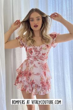 Shop Our Catalog of Women Sets, Rompers & Jumpsuits by Vitaly Couture | Women Outfits | Introducing our Floral Ruffle Tiered Romper, a perfect choice for those who love a touch of bohemian flair in their outfits. This romper features a delightful floral print that adds a vibrant and playful vibe to your look. The off-the-shoulder design and puff sleeves create a romantic and breezy feel, perfect for warm-weather days. The tiered ruffle details give the romper a flowy and feminine appearance, while the self-tie waist allows you to cinch it for a flattering silhouette. The back invisible zipper ensures easy wear, and the overall design exudes effortless charm.  rompers for women | date night outfits | date night rompers | date night romper | Maxi Romper, Dream Dresses, Ruffle Romper, Floral Ruffle, Floral Romper, Puffed Sleeves, Sleeved Romper, Effortless Chic, Shoulder Design